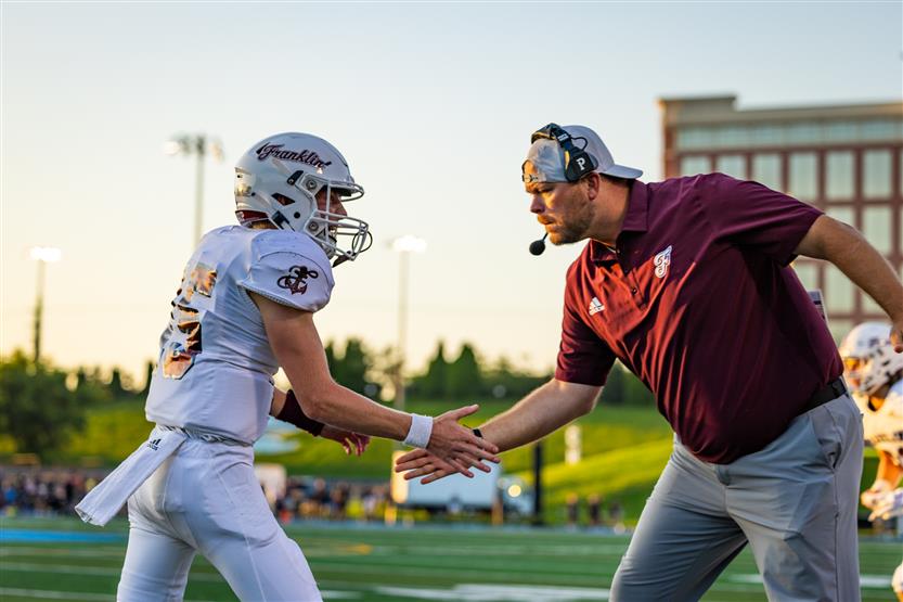Student-athletes play football